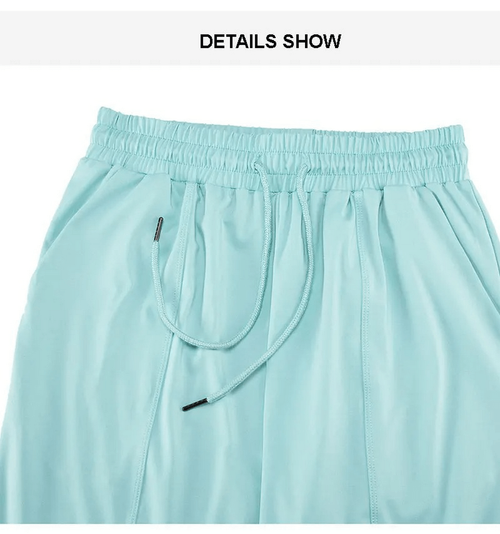 Close-up of blue athletic pants from women's three-toned breathable sports clothing set, featuring elastic waistband and drawstring.